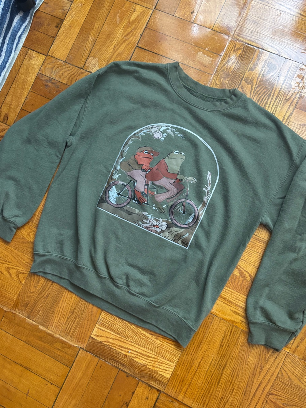 Vintage Style Frog and Toad Riding Bicycle Sweatshirt | Olive Green Pullover